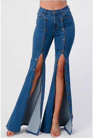 Long denim flare jeans that have bronze buttons up the leg. 