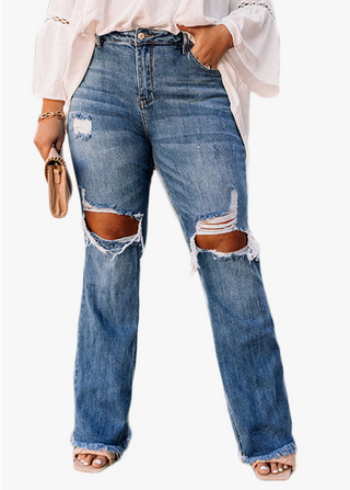 Plus sized woman wearing distressed blue jeans with knee cut outs.