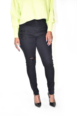 Woman's black jeans with distressing and zipper closure at the ankle 